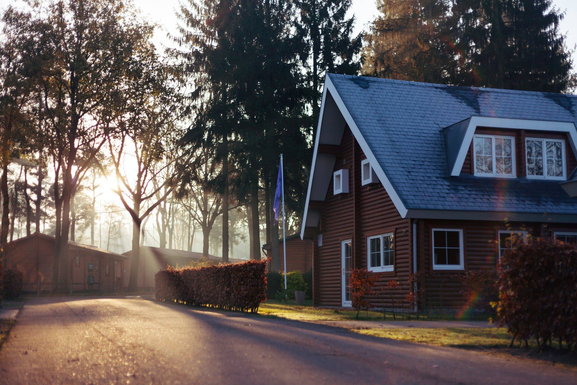 Single-family home with a dormer roof at sunrise